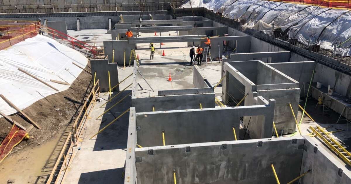 aerial view of workers on a building construction site 